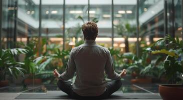 ai généré homme séance dans lotus position dans de face de bâtiment photo