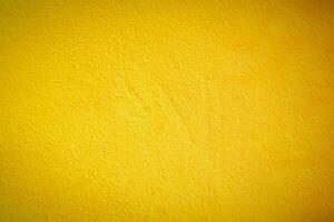 vibrant Jaune ciment mur texture, parfait conception Contexte. photo