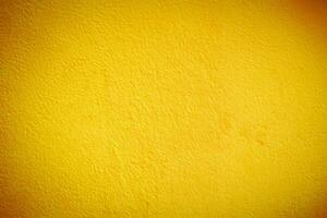 vibrant Jaune ciment mur texture, parfait Contexte pour conception projets. photo