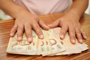 thaïlandais baht billet de banque argent, investissement économie, comptabilité affaires et bancaire. photo