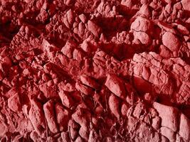 texture de pierre rouge dans le jardin photo