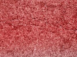 texture de pierre rouge dans le jardin photo