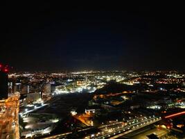 aérien nuit vue de illuminé ville centre bâtiments de Birmingham central ville de Angleterre uni Royaume. Mars 30e, 2024 photo