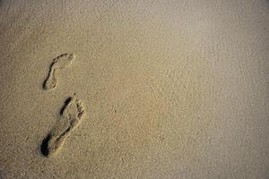 empreintes humaines dans le sable photo