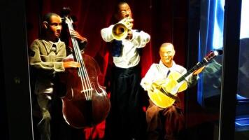 numérique La peinture style représentant une le jazz trio dans performance, avec guitare, acoustique basse et trompette photo