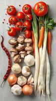 Frais des légumes assortiment sur une gris Contexte photo