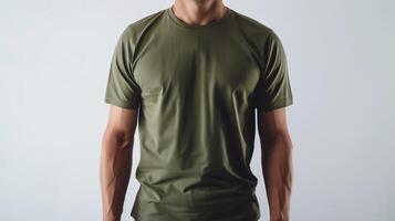 ai généré une maquette de le de face vue T-shirt, portant par un athlétique homme dans militaire vert couleur. homme permanent contre blanc Vide Contexte. généré par artificiel intelligence. photo