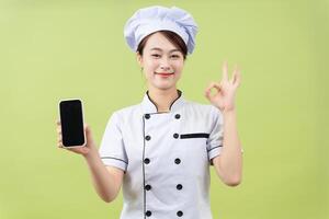 photo de Jeune asiatique femelle chef sur Contexte