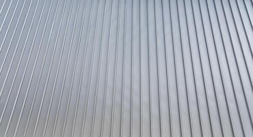 le texture de le bardage de le bâtiment de métal aluminium panneaux. abstrait Contexte. photo