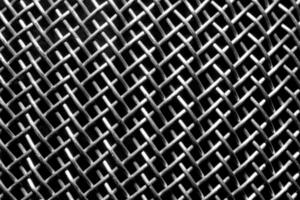 monochrome texture de une brillant métal passoire ou grille. abstrait Contexte. photo