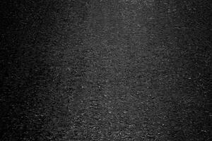 abstrait asphalte texture sur foncé Contexte. photo