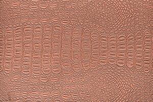 Orange corail crocodile cuir texture. abstrait toile de fond pour conception. photo