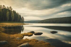 une Lac entouré par des arbres et rochers photo