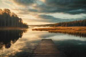 une en bois Dock pistes à une Lac entouré par des arbres photo