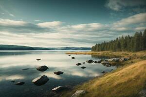 une Lac avec rochers et des arbres dans le premier plan photo