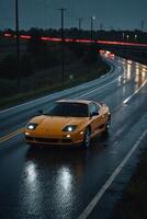 une des sports voiture conduite vers le bas une humide route à nuit photo