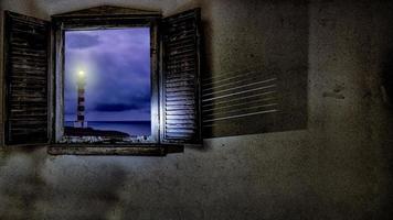 phare à travers la fenêtre sur l'île de gran canaria photo