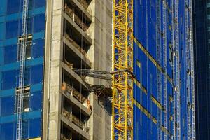 Ouzbékistan, Tachkent - septembre 27, 2023 le processus de bâtiment Nouveau gratte-ciel bâtiments. photo