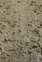 texture de l'ancien mur de béton gaufré de couleur grise. image de fond d'un produit en béton photo
