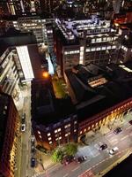 aérien nuit vue de illuminé central Manchester ville et centre ville bâtiments, Angleterre uni Royaume. mai 4ème, 2024 photo