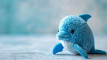 bleu duveteux peluche dauphin jouet avec texturé doux en tissu sur une serein Contexte photo