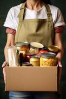 don de bénévole assistance des boites avec Vêtements des produits à le pauvres photo