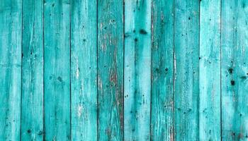 vieux fond de texture bois bleu foncé. mur en bois peint. fond bleu une clôture lumineuse faite de planches verticales. la texture d'une planche de bois peut être utilisée pour l'arrière-plan. un peu de peinture craquelée. photo