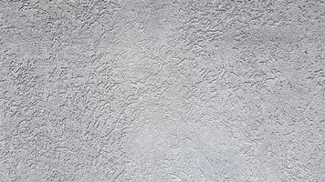 abstrait gris. beau stuc texturé gris sur le mur. fond de stuc gris. photo