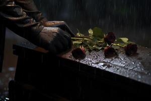 fermer de une funéraire cercueil à une cimetière avec fleurs dans le pluie, main sur le la tombe dans le pluie avec foncé Contexte et Rose ai généré photo