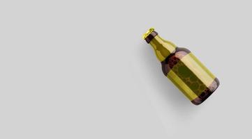 vue de dessus une bouteille de bière brune avec un modèle jaune vierge isolé sur fond gris. concept de fête de la bière. photo