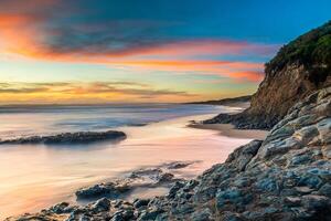 littoral le coucher du soleil dans philippe île, victoria, Australie photo