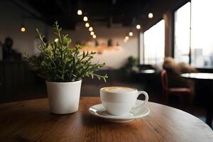 café tasse et plante orner table dans confortable café magasin intérieur photo