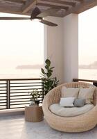 une confortable Extérieur balcon salon avec une osier salon chaise avec oreillers, et une la nature voir. photo