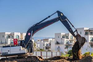 excavatrice creusement sol à une construction site 4 photo