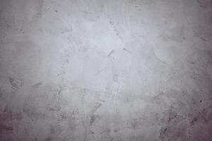 une gris mur avec une gris Contexte. le mur est couvert dans une gris peindre et a une rugueux texture photo