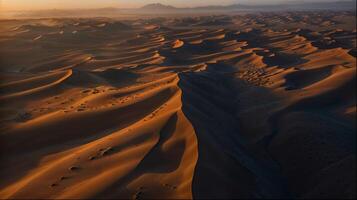 aérien vue de désert paysage avec montagnes et vallées à le coucher du soleil photo