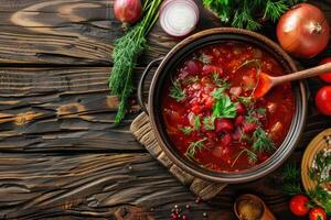 une assiette de betterave racine soupe Bortsch sur une en bois table avec légumes, Haut voir. fait maison nourriture Contexte avec copie espace photo