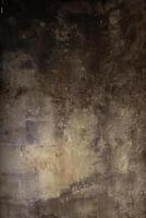 rustique texturé béton mur Contexte dans foncé marron teinte photo