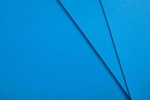 géométrique conception, bleu carton abstrait Contexte dans plat allonger composition. photo