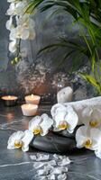 élégant spa réglage avec allumé bougies, fleurs, les serviettes, lisse des pierres. calmant bien-être battre en retraite pour relaxation. concept de luxe thaïlandais spa, tranquillité, soins auto-administrés. copie espace. verticale photo