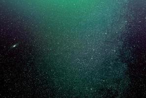 fond de galaxies abstraites avec étoiles et planètes avec motif galaxie verte de l'univers de la veilleuse photo