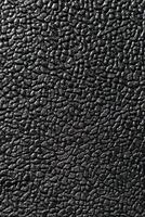 la texture en cuir artificiel en noir pour une collection de motifs de fond. un élément graphique pour un design créatif. photo