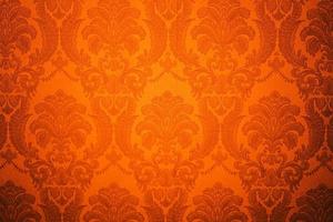 motif de papier peint damassé. abstrait avec la couleur orange. damassé beau fond avec ornementation de luxe. photo