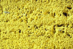 mur de pierre parfaitement organisé, texture jaune de la texture de fond du mur de pierre photo