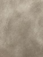 texture de cuir en beige. résumé de ligne détaillé du matériau de surface en cuir. motif en cuir naturel pour un design luxueux. photo