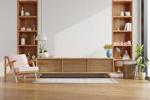 meuble pour tv sur le mur blanc dans le salon avec fauteuil, design minimaliste. photo
