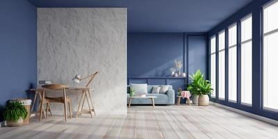 intérieur de la salle lumineuse avec canapé sur un mur bleu foncé vide et bureau sur un mur de plâtre blanc vide.