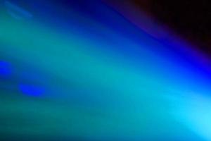 néon bleu abstrait néon lumineux lens flare coloré sur fond noir.fond futuriste abstrait sombre et néon photo