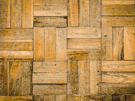 texture de parquet en bois sans couture. utilisation de la texture du bois ancien pour le fond. vue de dessus du fond texturé marron de planches de bois. parquet naturel texture de sol sans couture photo