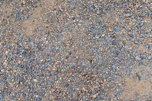 texture colorée de sable ou de galets. texture transparente sur la texture du sol. photo